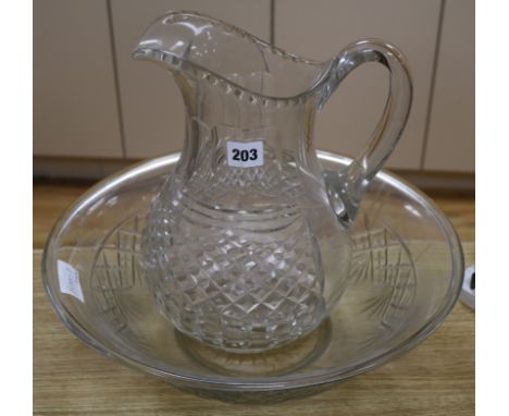 An Edwardian cut glass ewer and basin