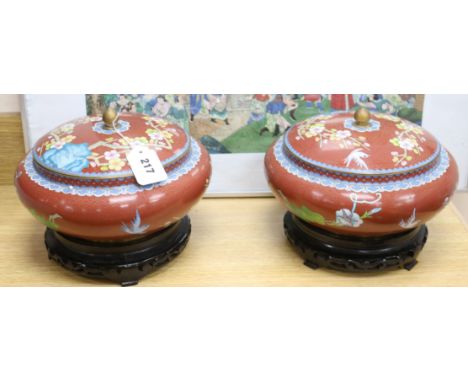 A pair of Chinese cloisonne enamel bowls and covers, wood stands diameter 17cm height 21cm