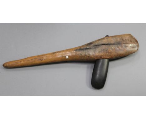 An Obsidian hand axe mounted on a hardwood shaft, overall 71cm
