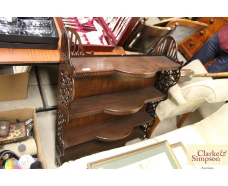 A mahogany Chippendale style hanging wall shelf 