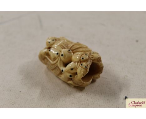 A carved bone Netsuke 