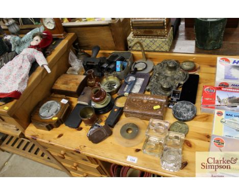 A Victorian brass desk stand; an oak barometer; various glass inkwells; desktop items etc.