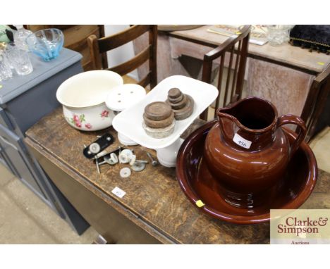 A brown glazed Denby toilet jug and basin; a set of enamel scales and weights; and a rose decorated chamber pot