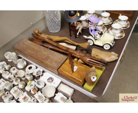 A quantity of carved wooden items including a chocolate mould, cigarette box, serving fork and spoon, shoe tree etc. 