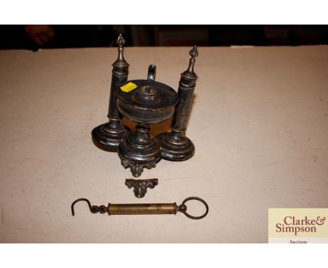 A Victorian plated desk stand with integral lamp, and a brass spring balance