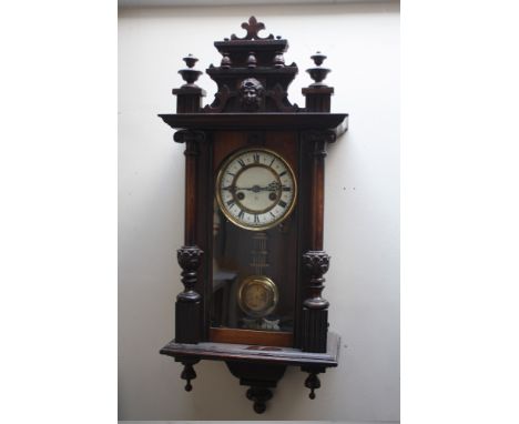 A LATE 19/EARLY 20TH CENTURY VIENNA WALL CLOCK OF SMALL PROPORTIONS, the enamel dial with Roman numerals, pendulum, H 77 cm