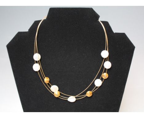 A LADIES DESIGNER 18CT GOLD PEARL AND DIAMOND THREE STRAND NECKLACE, together with a pair of matching earrings (3)