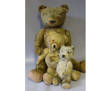 A LARGE VINTAGE PLAYWORN MOHAIR TEDDY BEAR, possibly Farnell or similar, jointed limbs with broad shoulders and large feet, h