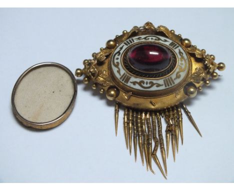 A VICTORIAN TYPE MOURNING BROOCH,  with central cabochon stone and white enamel detail, removable panel to reverse, unmarked 