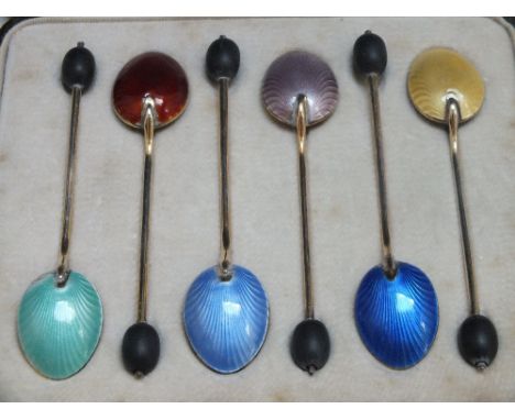 A CASED SET OF SIX ART DECO HALLMARKED SILVER AND GILT COFFEE BEAN SPOONS WITH GUILLOCHE ENAMEL DECORATION, varying hallmarks