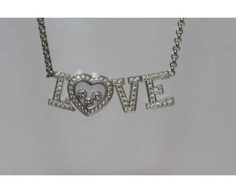A CHOPARD 18CT WHITE GOLD 'HAPPY LOVE' NECKLACE, diamond weight 0.72ct
