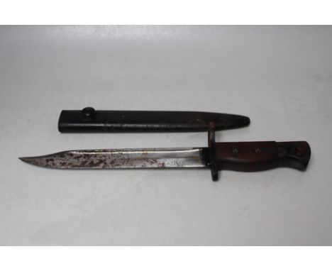 A NO. 5 JUNGLE CARBINE BAYONET, made by Wilkinson Sword, blade L 8" / 20 cm, together with steel scabbard