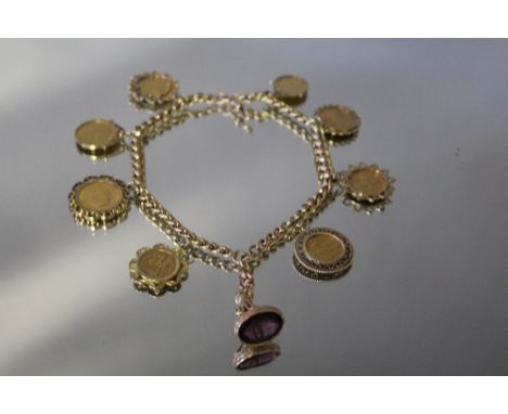A 9CT GOLD ROLLER CHAIN SET WITH AN ORNATE AMETHYST SEAL AND EIGHT ASSORTED GOLD COINS,&nbsp;comprising four full sovereigns 