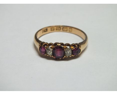 AN 18CT GOLD FIVE STONE RUBY AND DIAMOND SET RING, ring size L, approx weight 2.7g