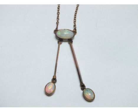 AN EARLY 20TH CENTURY 9CT GOLD OPAL PENDANT / DROPPER NECKLACE, with single central opal and two 9ct gold droppers terminatin