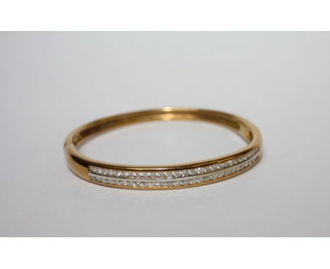 AN 18CT GOLD AND DIAMOND BANGLE, set with two rows of diamonds, diamond weight 2.00ct, weight 30.3 gms