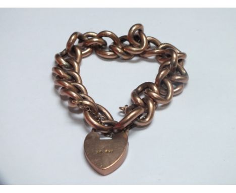A YELLOW METAL CHAIN LINK / CHARM BRACELET WITH HEART SHAPED CLASP, the clasp and links individually stamped 9ct, approx 22.7