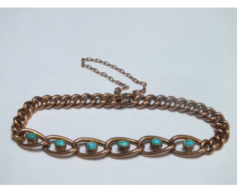 AN ANTIQUE YELLOW METAL CHAIN LINK BRACELET, the larger central links set with six turquoise stones in rub over mounts, the c