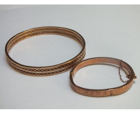 AN ANTIQUE 9CT GOLD RETICULATED BANGLE, Dia. 7 cm,  approx W 14.9 g, together with an unmarked yellow metal christening bangl