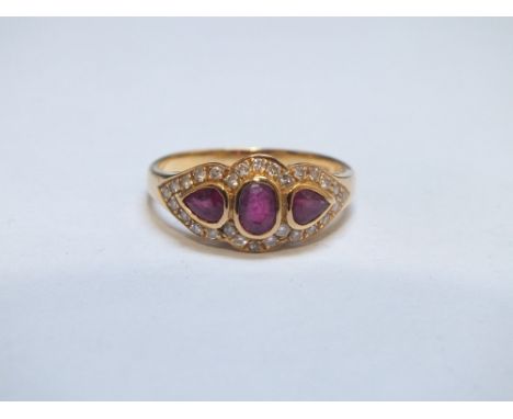 A HALLMARKED 18 CT GOLD THREE STONE RUBY AND DIAMOND RING, approx weight 3.3g, ring size P