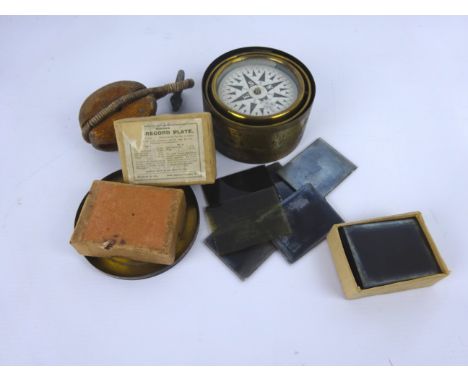 Early 20th century brass drum cased travel Compass with card dial in gimbal case with lid, 9.5cm diam, a small block pulley a