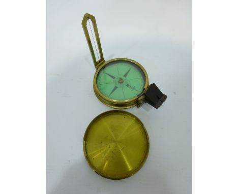 Late 19th century brass pocket compass and cover, green paper dial inscribed 'Elliott Bros Strand, London' and with hinged si