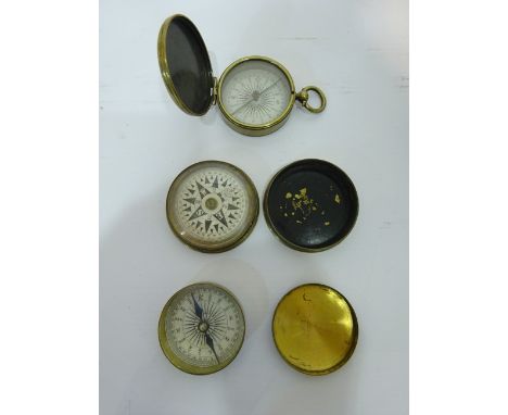 Early 20th century brass pocket compass with hinged cover by Watson, & Son High Holborn, and two brass pocke compasses with s