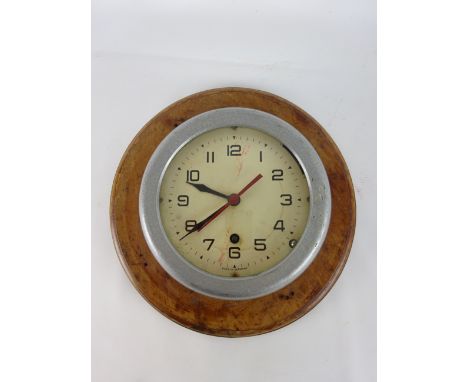 German Bulk head clock, cream Arabic dial with red centre sweep seconds, in aluminium case on mahogany board, dial D16cm,    