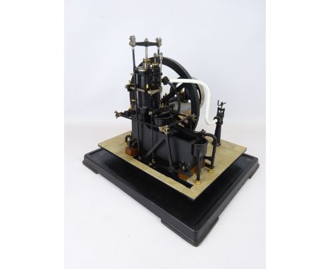 Hand built scale kit model of a single cylinder stationary steam engine, with spoked fly wheel and on cast iron base, powered