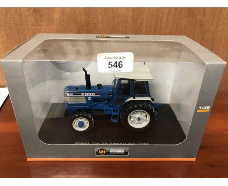 A UNIVERSAL HOBBIES FORD TW25 FORGE II 1-32 SCALE , ITEM NO UH4028 MODEL BOXED AND IN MINT CONDITION 