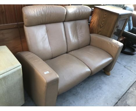 A STRESS LESS LEATHER TWO SEATER SOFA 