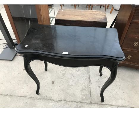 A FOLDING EBONY CARD TABLE WITH GREEN BAIZE TOP 