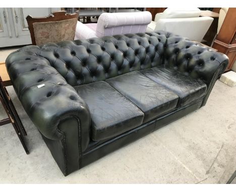 A GREEN LEATHER BUTTON BACK THREE SEATER CHESTERFIELD SOFA 