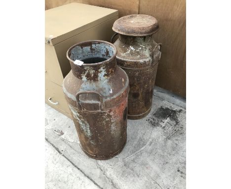 A PAIR OF VINTAGE MILK CHURNS (ONE WITH CORROSION TO THE BASE) 