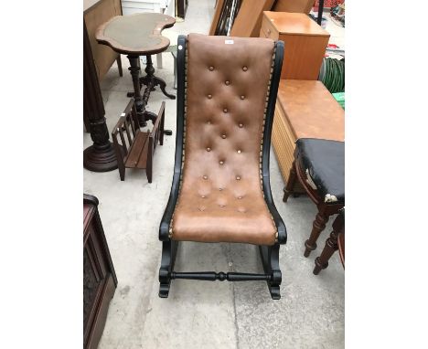 A BUTTON BACK LEATHER SLIPPER ROCKING CHAIR 