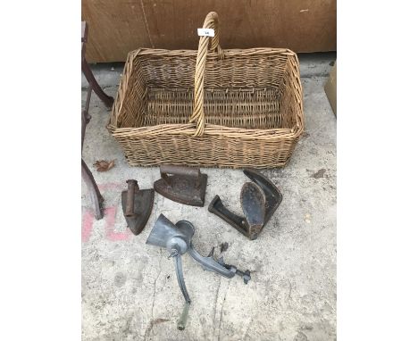 A VINTAGE WICKER PICNIC BASKET,TWO IRONS,A SHOE LAST AND A MINCER 