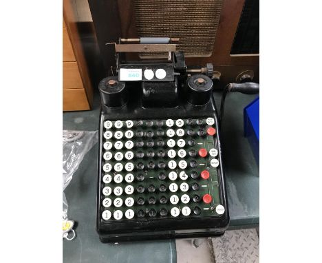 A VINTAGE HAND PULL ADDING MACHINE 
