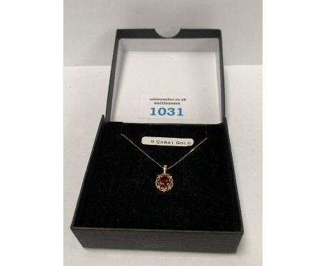 A BOXED 9CT GOLD NECKLACE TOGETHER WITH RUBY STYLE PENDANT , GROSS WEIGHT 1.1 G 