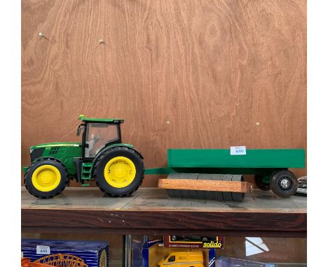 A MODEL JOHN DEERE TRACTOR AND WOODEN TRAILER WITH IMPLEMENT 