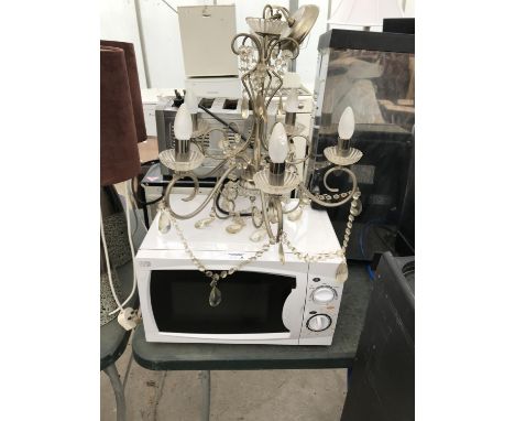 A MICROWAVE AND A FIVE ARM CHANDELIER LIGHT FITTING 
