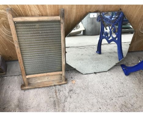 AN UNFRAMED OCTAGONAL MIRROR AND A VINTAGE WASHBOARD 