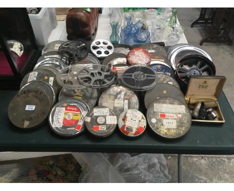 A LARGE QUANTITY OF VINTAGE FILM REELS AND CASES 