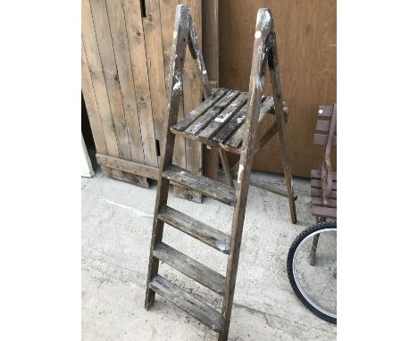 A SET OF VINTAGE WOODEN STEP LADDERS 