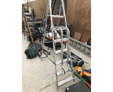 A SIX RUNG ALUMINIUM STEP LADDER WITH A PAIR OF WHEEL ARMS 