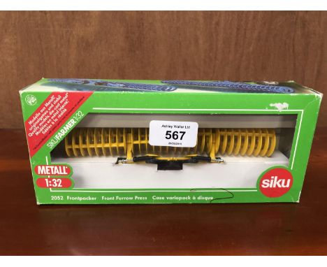 A SIKU IMPLEMET FRONT FURROW PRESS , 1-32 SCALE, REF NO 2052 BOXED AND IN MINT CONDITION 