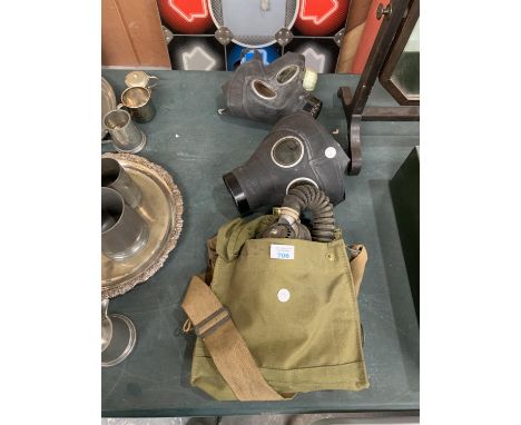 THREE VINTAGE GAS MASKS, ONE WITH CLOTH BAG 