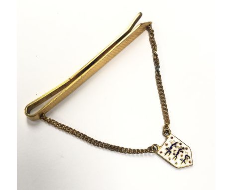 A ROLLED GOLD TIE SLIDE WITH ENAMEL THREE LIONS BADGE ON CHAINS 