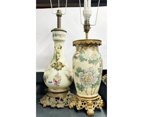 An antique French porcelain and gilt metal base table lamp, H. 72cm with shade frame, together with a Japanese porcelain and 