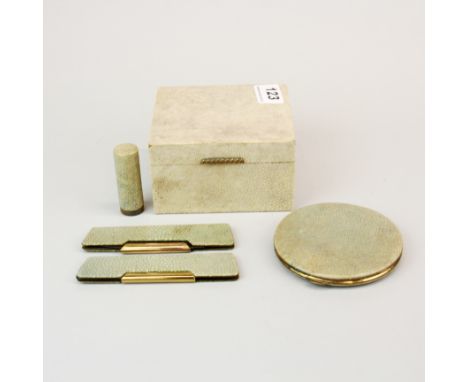 A 1930's shagreen covered cigarette box ( 11 x 10 x 6cm), powder compact, 2 combs and a lipstick case.