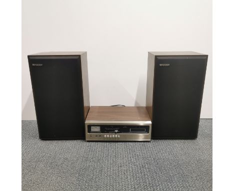 A Hitachi D-135 tape deck together with a pair of Sharp CP-461E three way speakers, speaker H. 48cm.